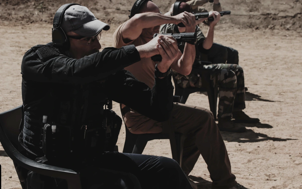 C.A.R Center Axis Relock seated pistol shooting drill at BZ Academy in Poland