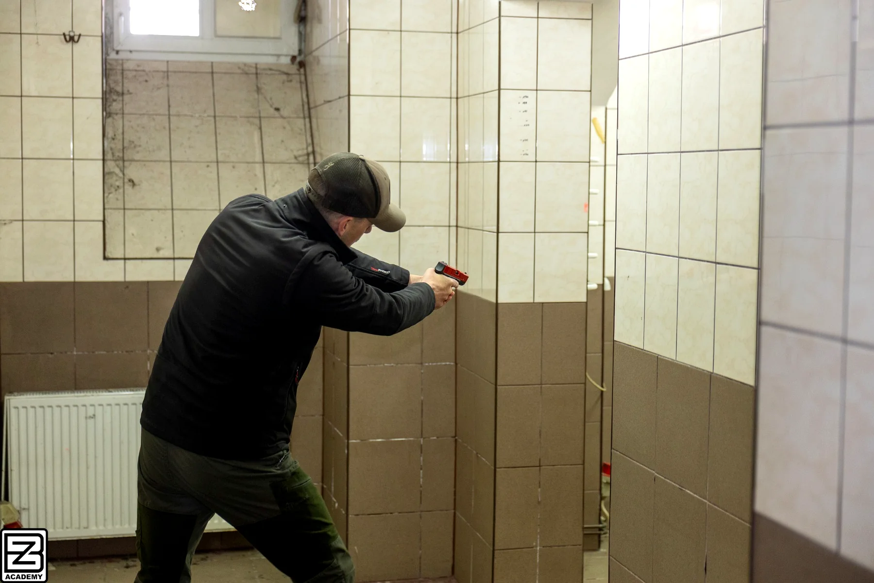 One Man CQB student using cover during close-quarter training at BZ Academy in Poland